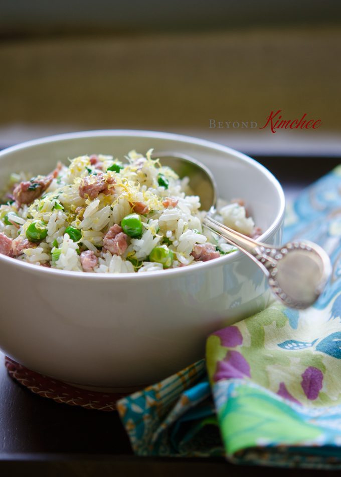 Leftover rice is stir-fried with sausage, peas, and lemon.