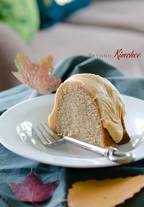 A slice of Spic Cake with Caramel Icing is served on a dish.