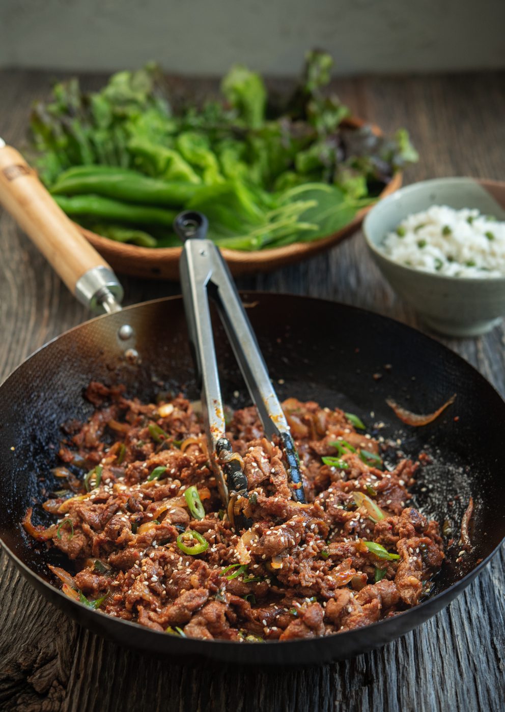 Spicy pork bulgogi cooked in a wok with gochujang sauce