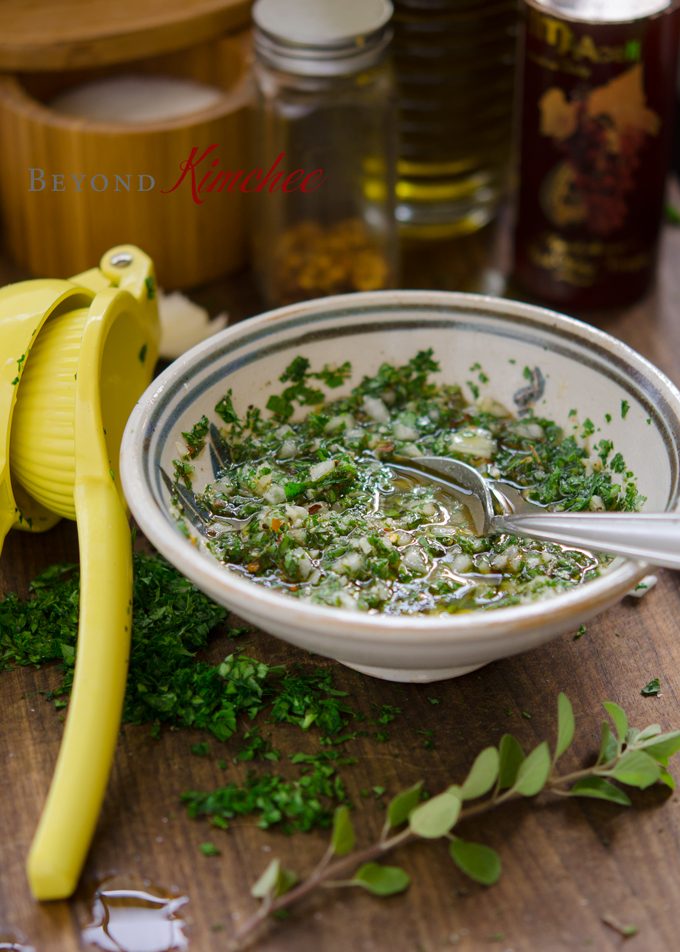 Chimichurri sauce is made with fresh herbs, onion, chili and lemon juice