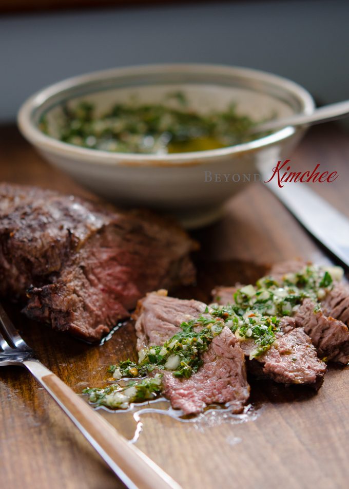 Beef steak is topped with Chimichurri Sauce