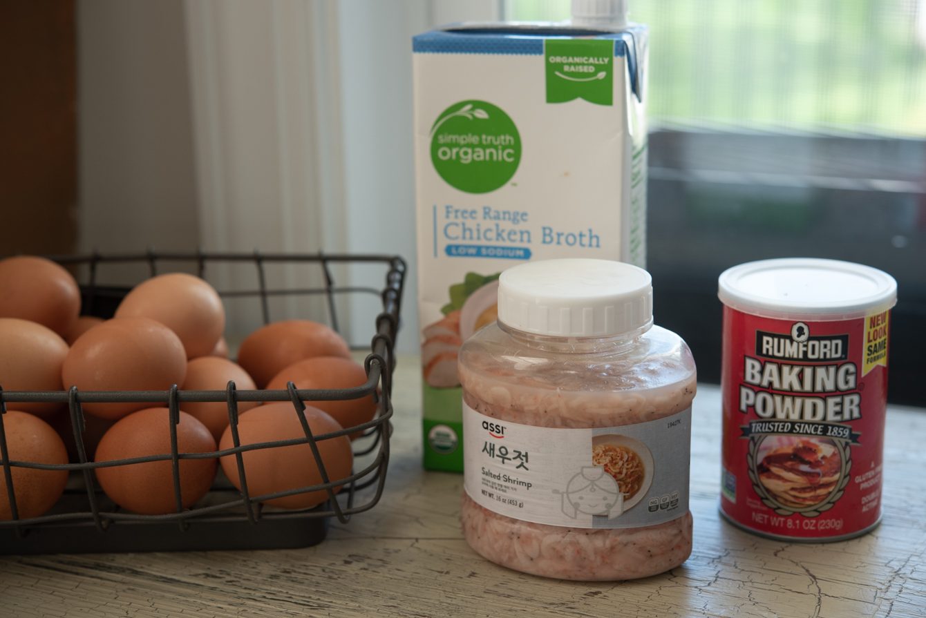 Ingredients for gyeran jjim: eggs, chicken broth, salted shrimp, and baking powder