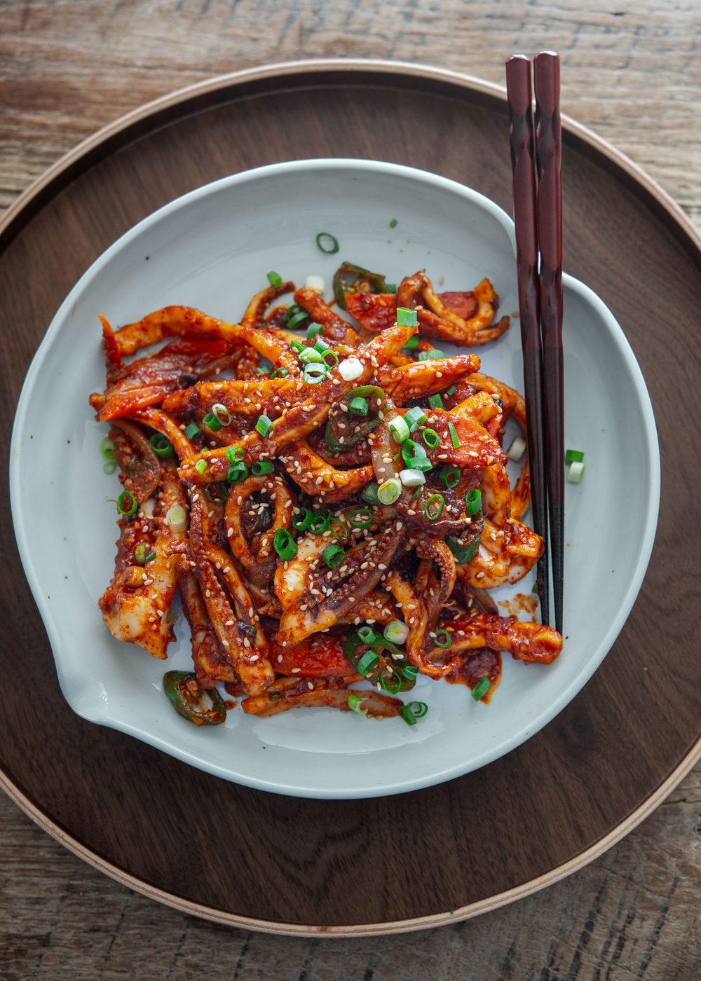 Korean spicy squid stir-fry (ojingeo bokkeum) in a serving dish.