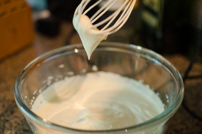 Whipped cream is beaten until soft peak forms.