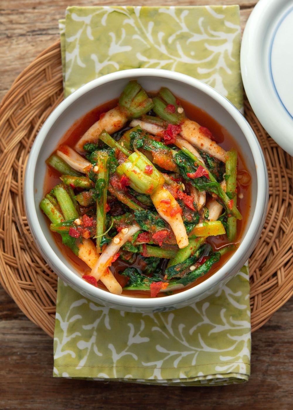Yeolmu kimchi made with young Korean radish greens in light spicy brine, served in a bowl