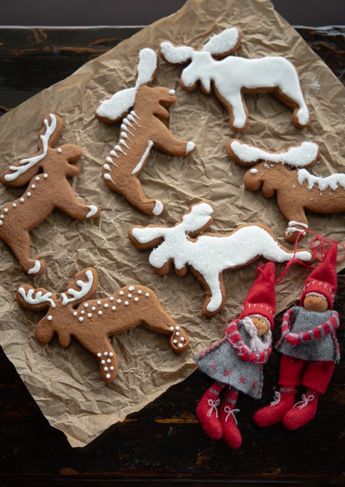 Old-style Swedish gingerbread cookies (Pepparkakor) is decorated with white icing.