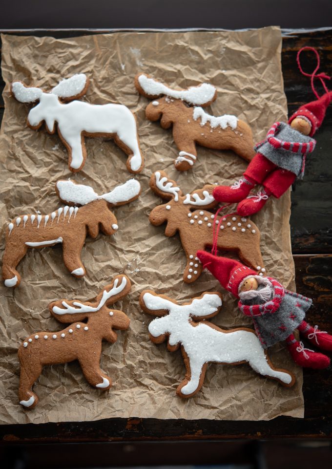 Old-style Swedish gingerbread cookies (Pepparkakor) is decorated with white icing.