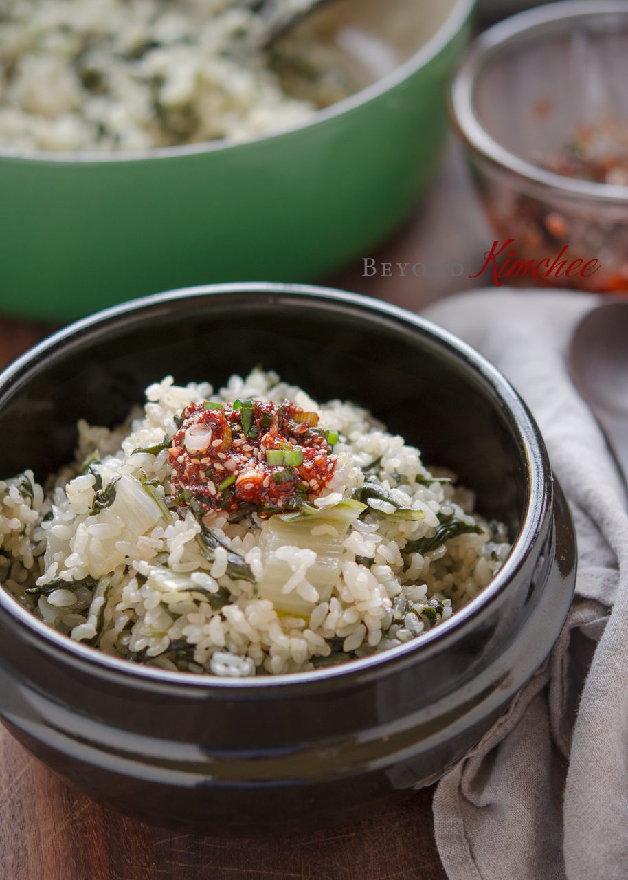 Brown rice is cooked with Swiss chard together and serve with chili topping sauce