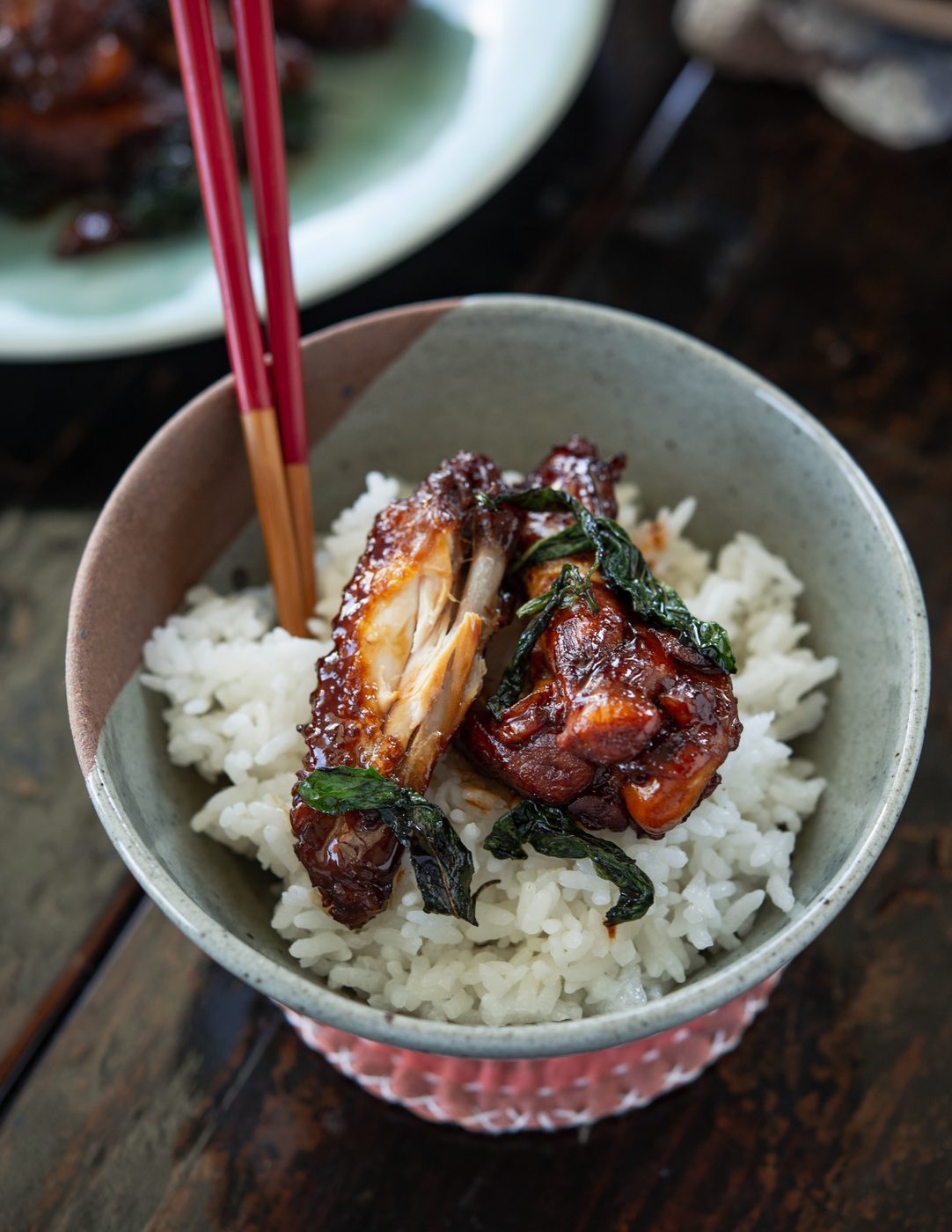 Three Cup Chicken wings (San Bei Ji) served over rice with wilted Thai basil