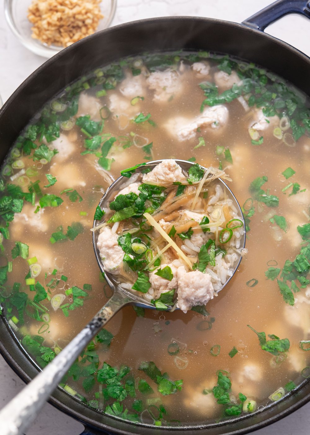 A comforting Thai breakfast soup made with jasmine rice and chicken.