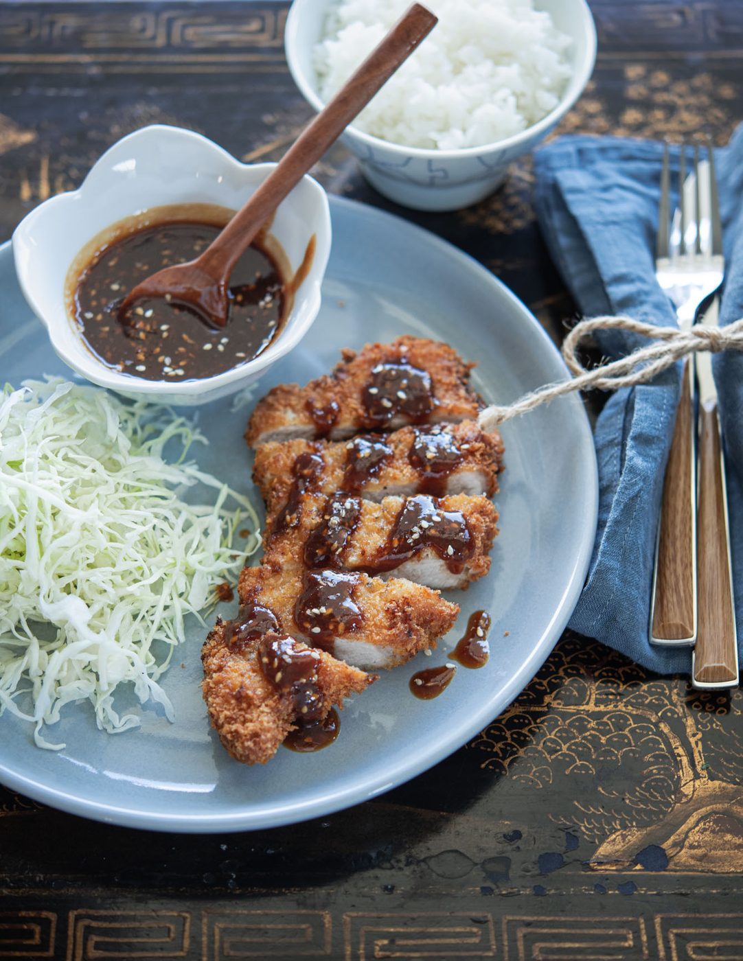 Japanese pork cutlet served with kitchen-made tonkatsu sauce and crisp cabbage.
