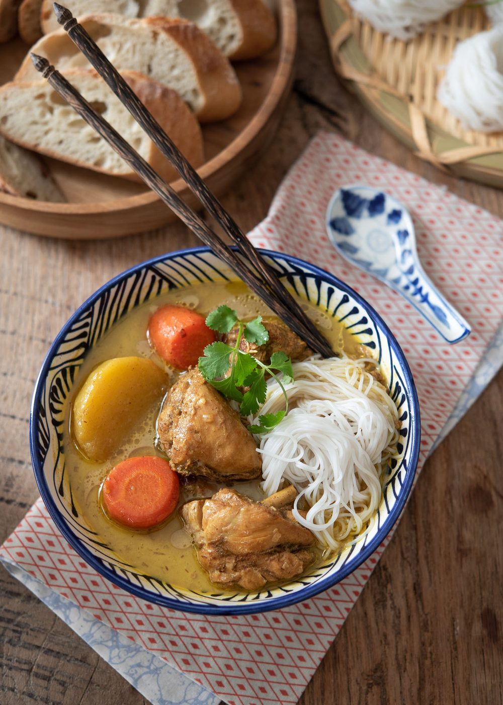 Vietnamese chicken curry with rice noodles added, paired with bread slices