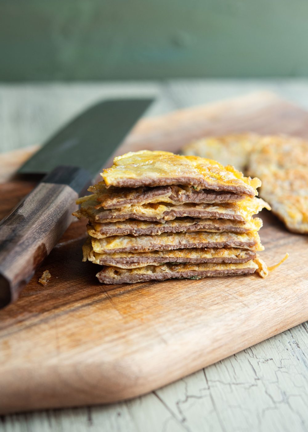 Sliced yukjeon showing thin and tender texture of Korean beef pancakes