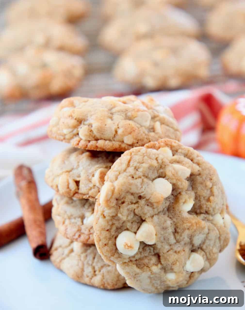 Autumn White Chocolate Pumpkin Delights 4 Pumpkin spice cookies with white chocolate chips on plate