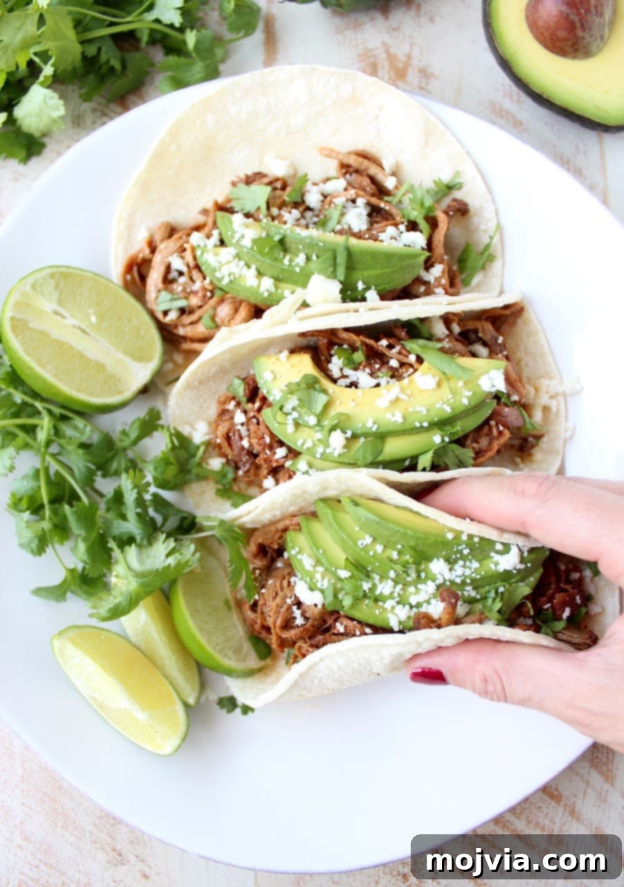 Melt-in-Your-Mouth Chipotle Honey Pulled Pork Tacos 2 Delicious Slow Cooker Pulled Pork Tenderloin Chipotle Honey Tacos, ready to be served