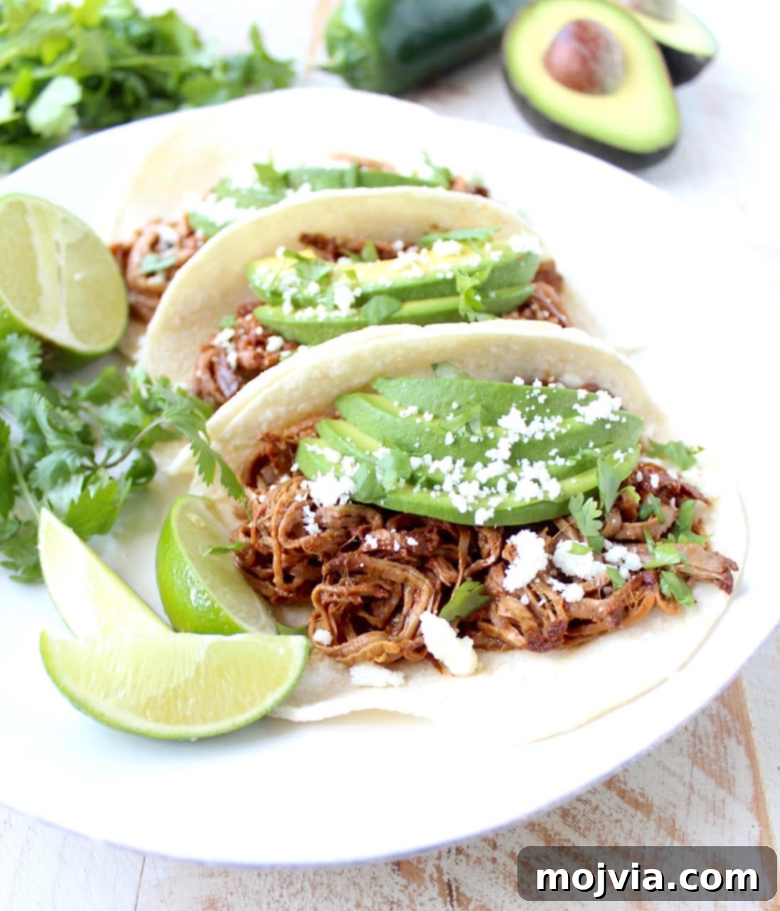 Melt-in-Your-Mouth Chipotle Honey Pulled Pork Tacos 3 Close-up of a fully assembled Slow Cooker Pulled Pork Tenderloin Chipotle Honey Taco with toppings
