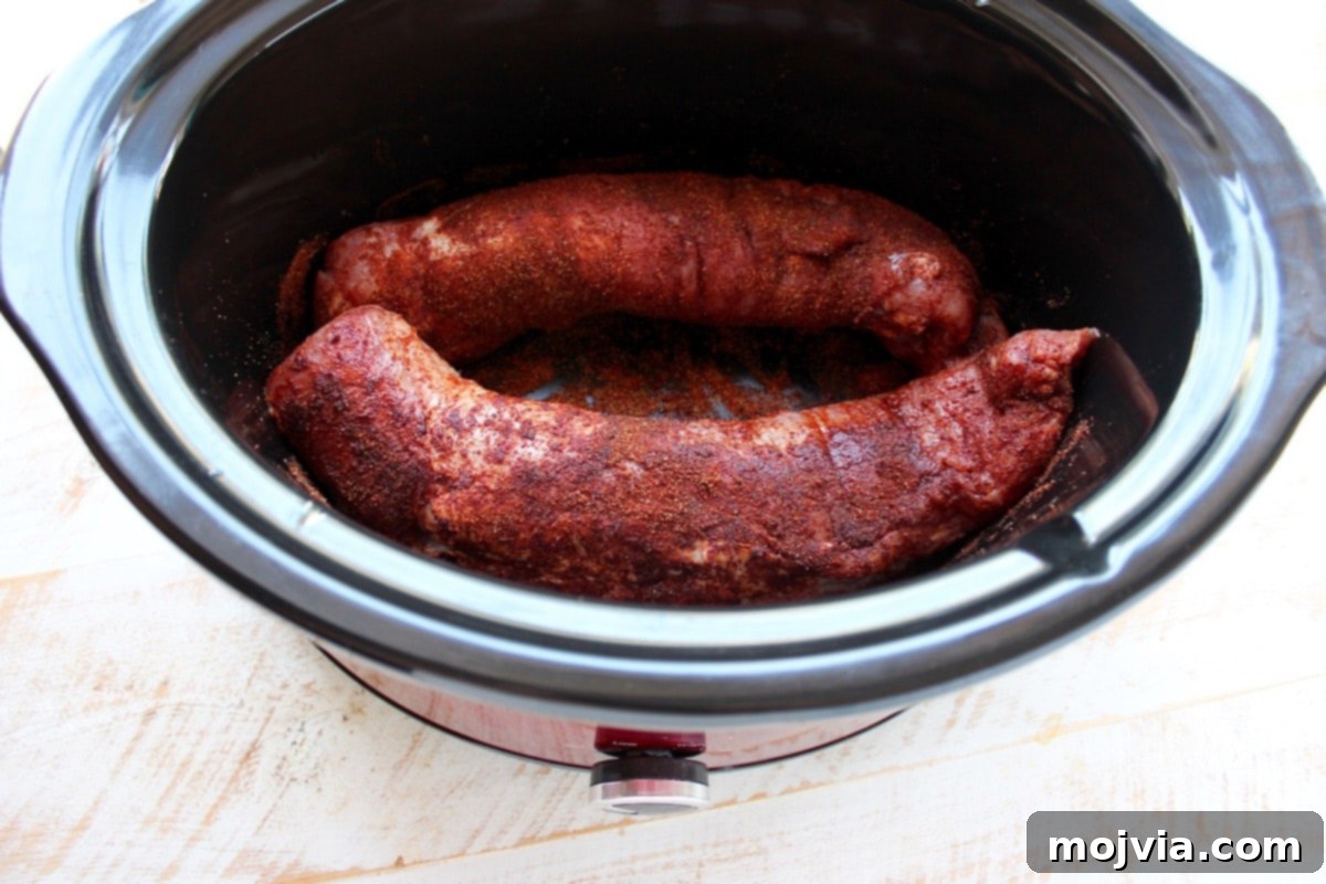 Melt-in-Your-Mouth Chipotle Honey Pulled Pork Tacos 5 Pork tenderloins placed in the slow cooker after seasoning