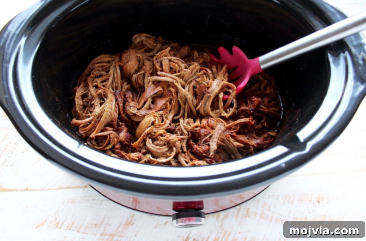 Melt-in-Your-Mouth Chipotle Honey Pulled Pork Tacos 7 Perfectly shredded pork tenderloin in the slow cooker with cooking liquid