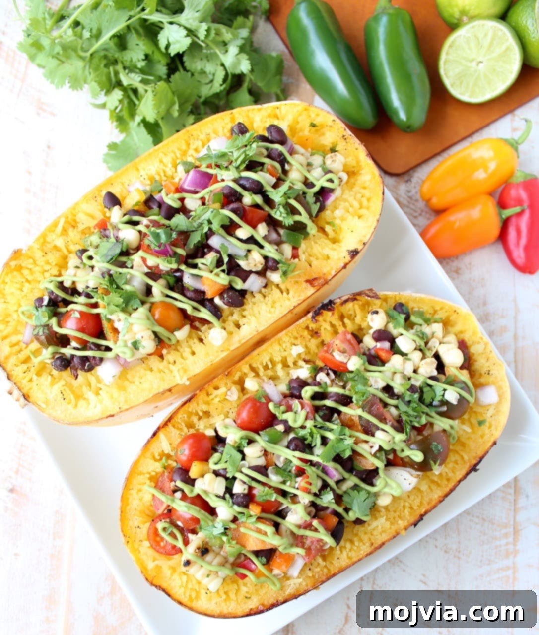 Savory Harvest Squash Boats 3 Roasted spaghetti squash filled with black bean corn relish on plate