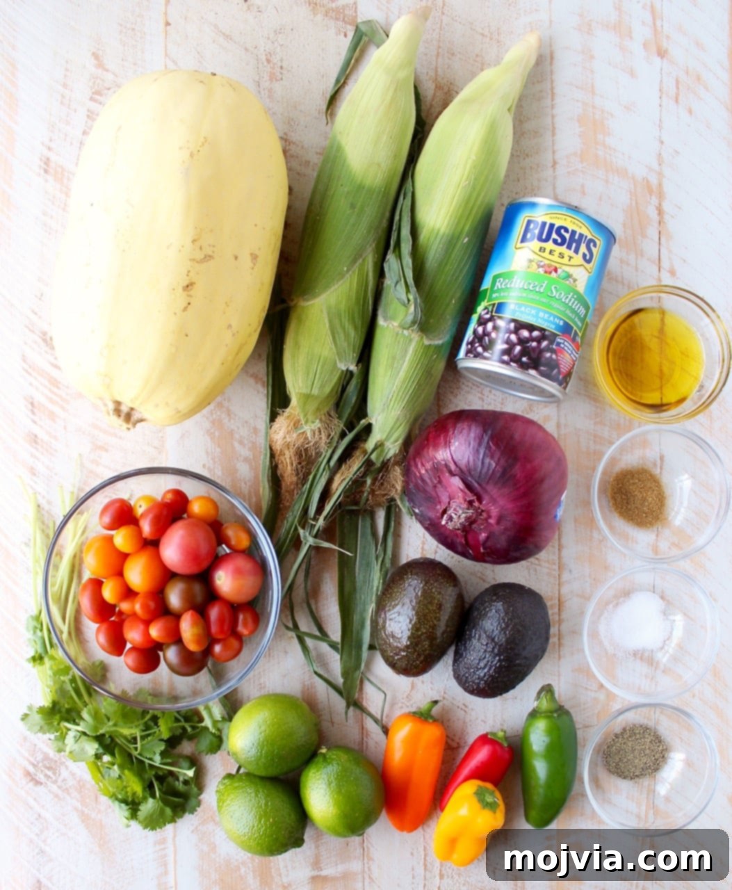 Savory Harvest Squash Boats 4 Ingredients for stuffed spaghetti squash on white wood board