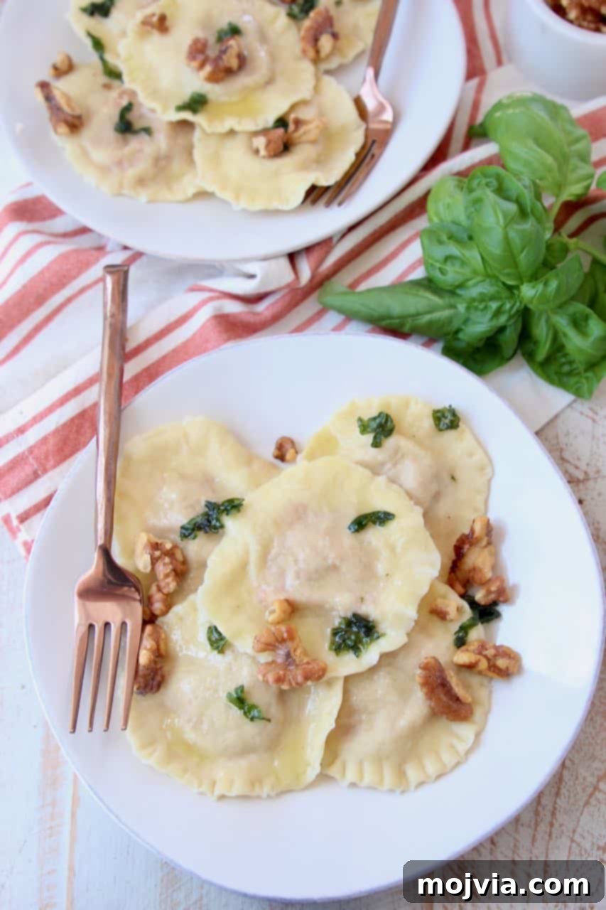 Golden Sweet Potato Ravioli 4 Overhead shot of raviolis on two plates with copper fork
