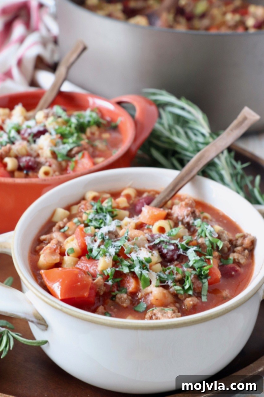 Hearty Pasta Fagioli 4 Two bowls of hot Pasta Fagioli soup with spoons, ready to be enjoyed as a hearty meal.