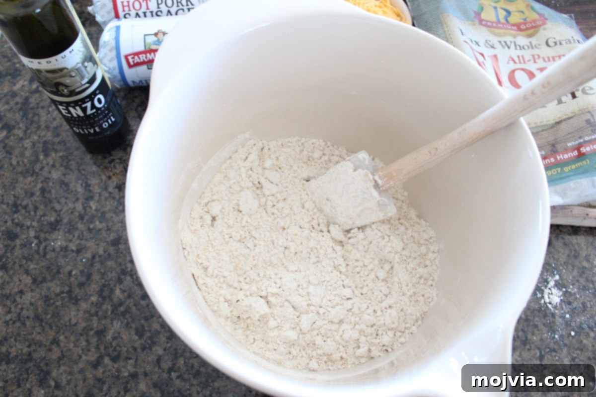 A white bowl filled with homemade gluten-free Bisquick mix, ready for the next steps.