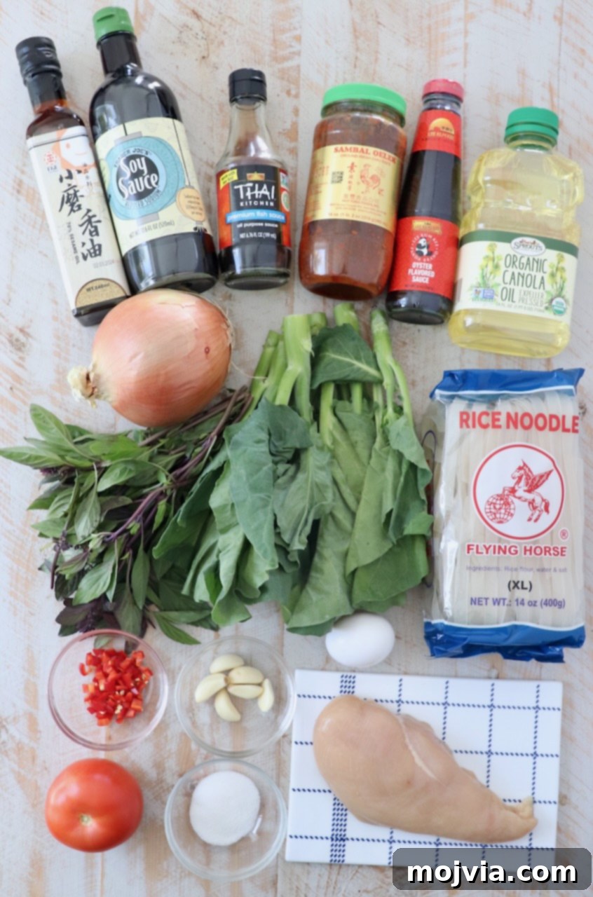 ingredients for drunken noodles on white wood board