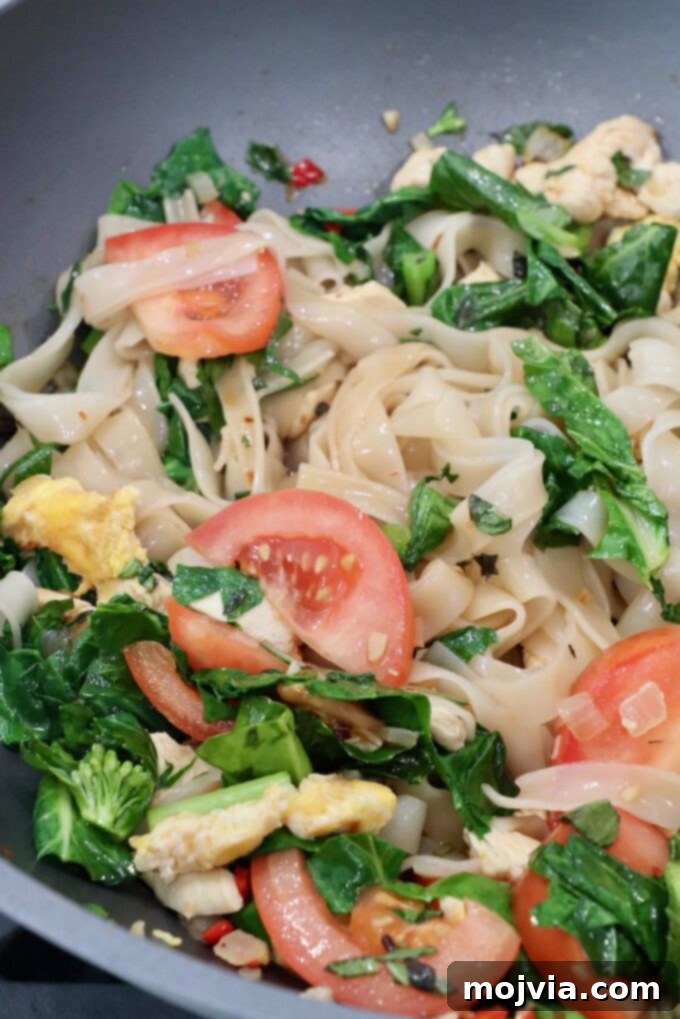 prepared drunken noodles in large wok