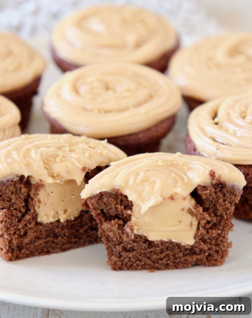 Wholesome Peanut Butter Chocolate Gluten Free Delights 3 Peanut butter filled chocolate cupcake cut in half on plate