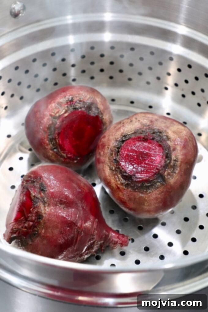 Blush Beet Hummus 4 Raw beets placed inside a steamer basket, ready for cooking.