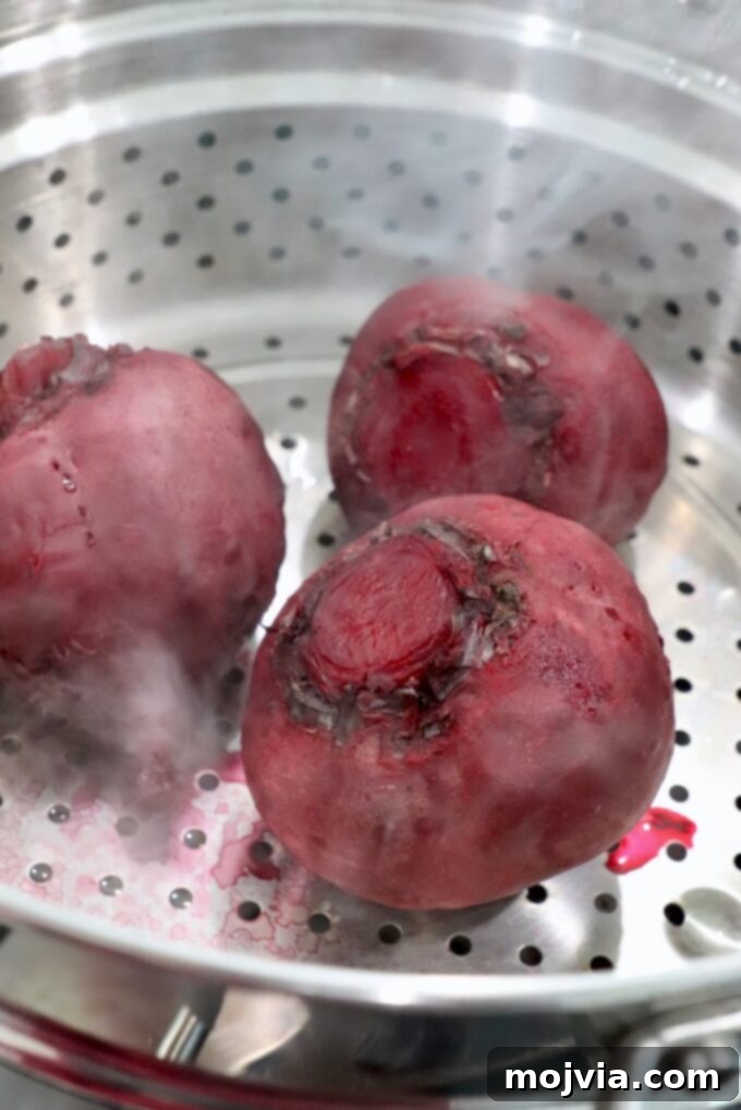 Blush Beet Hummus 5 Steamed beets visible within a steamer basket, indicating they are cooked and tender.