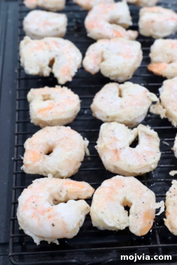 Golden Honey Walnut Prawns 8 battered cooked shrimp on wire rack