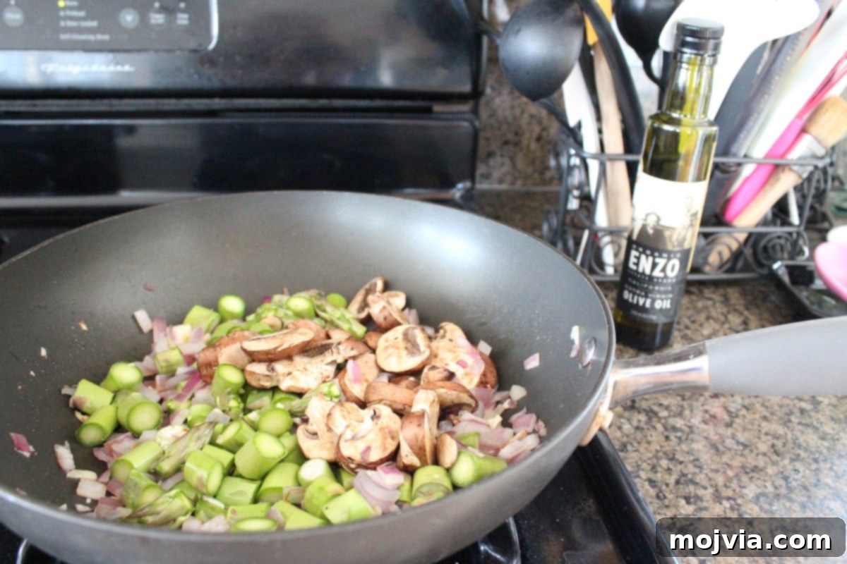 Vibrant Spring Garden Gluten Free Stuffing 4 Sautéing vegetables for the stuffing recipe in a skillet
