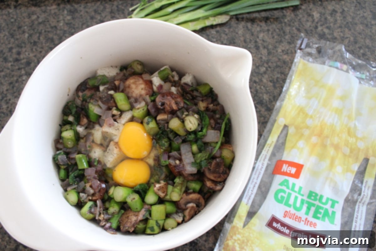Vibrant Spring Garden Gluten Free Stuffing 7 Pouring eggs and broth over the stuffing mixture