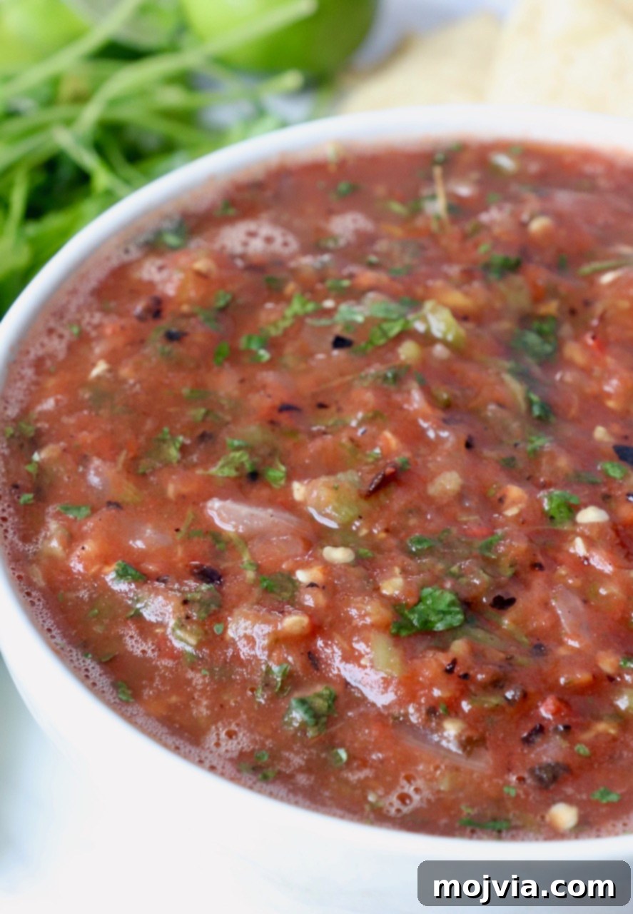 Your Go-To 10-Minute Fresh Salsa 2 A vibrant bowl of chunky, restaurant-style homemade salsa, perfect for dipping tortilla chips.