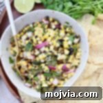 Fiesta Corn Salsa 7 corn salsa in bowl with spoon