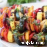 grilled vegetables on skewers on plate
