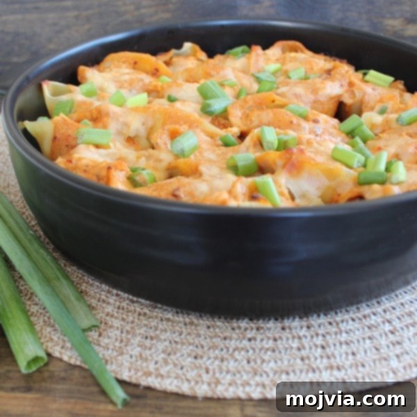 Freshly baked Buffalo Chicken Alfredo Stuffed Shells, golden and bubbling.