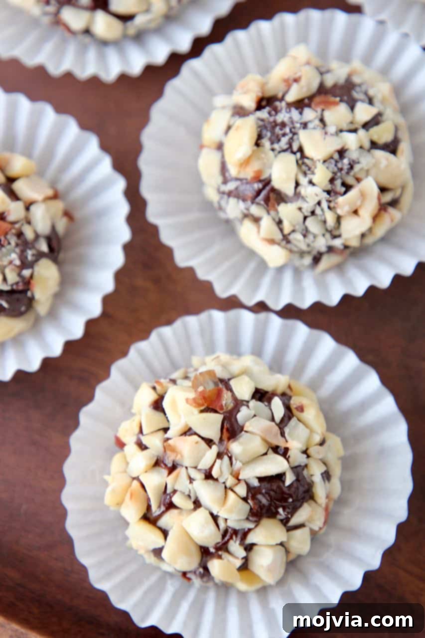 Brigadeiro truffles rolled in hazelnuts in mini candy cups