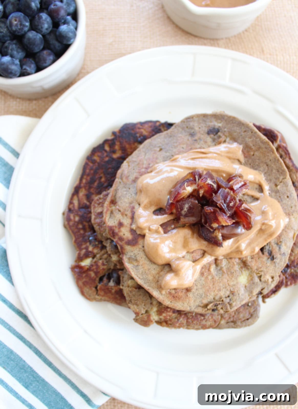 Energizing Banana-Date Protein Griddlecakes 2 Fluffy Banana Date Protein Pancakes Stacked High
