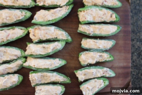 Smoky Sriracha Steak Popper Skewers 11 Jalapeño halves being stuffed with bacon cream cheese mixture