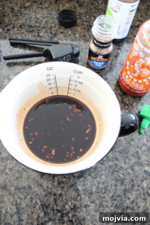 Smoky Sriracha Steak Popper Skewers 7 Sriracha steak marinade being prepared