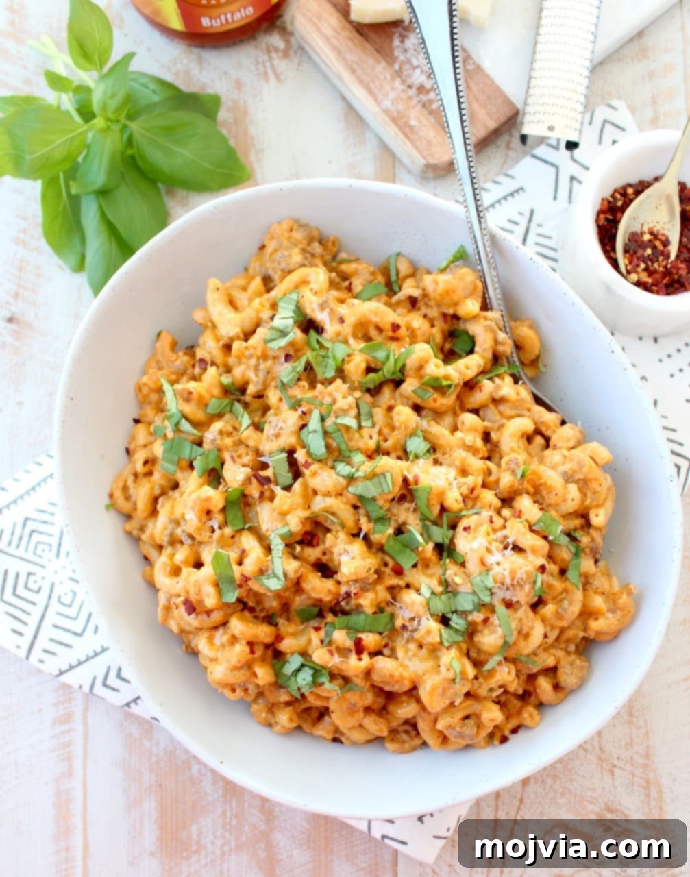 Buffalo Cheeseburger Macaroni: A Deliciously Meaty, Cheesy, and Spicy Pasta Dish Ready in Under 45 Minutes Buffalo Cheeseburger Macaroni in bowl with spoon, showcasing the rich, creamy texture and vibrant color.