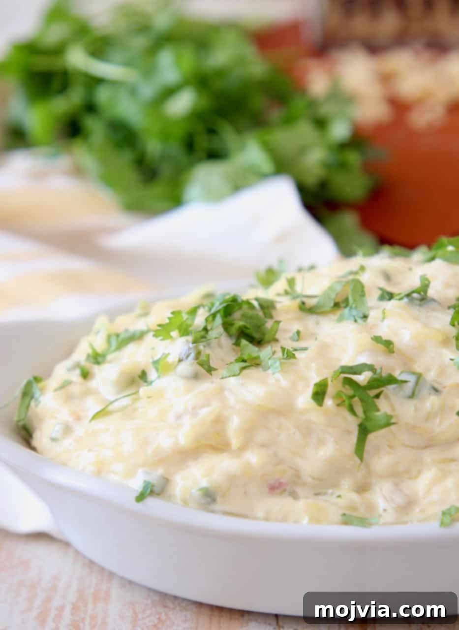 Spicy Cheesy Spaghetti Squash Boats 4 Spaghetti squash tossed with jalapeno cheese sauce in white baking dish