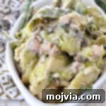 cooked brussel sprout casserole in white serving bowl