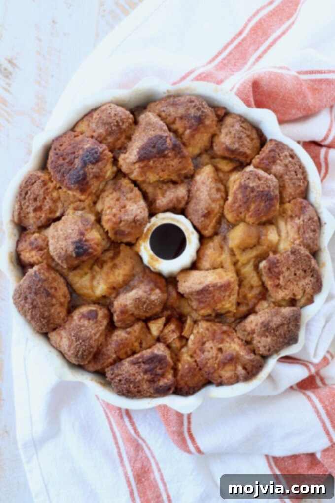Freshly baked pumpkin apple monkey bread cooling in the bundt pan after being removed from the oven.