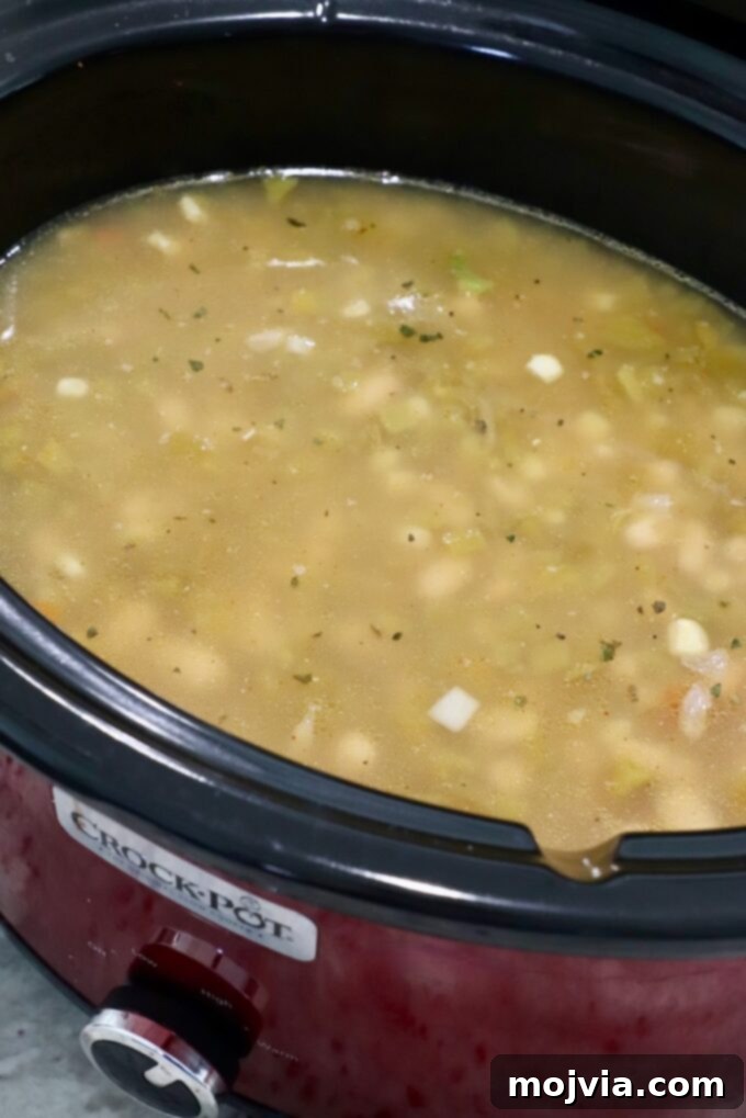 Homestyle White Chicken Chili 6 White chicken chili cooking in a slow cooker