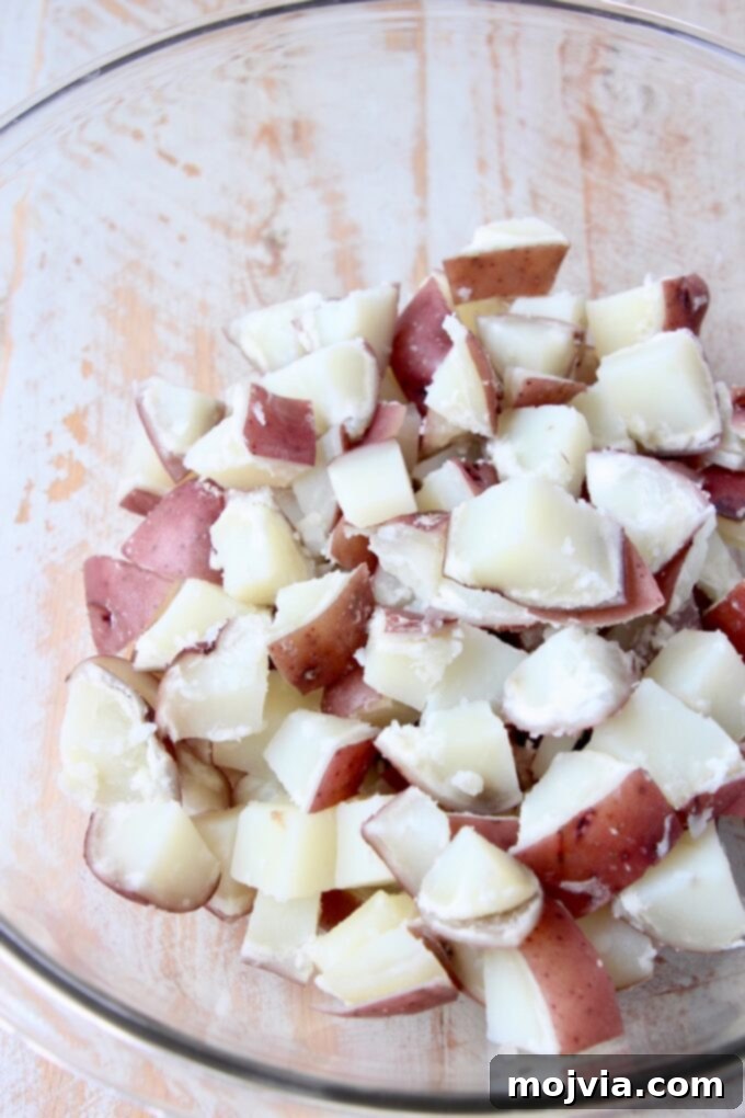 Buffalo Kick Potato Salad 4 boiled, cubed red potatoes in a large glass bowl