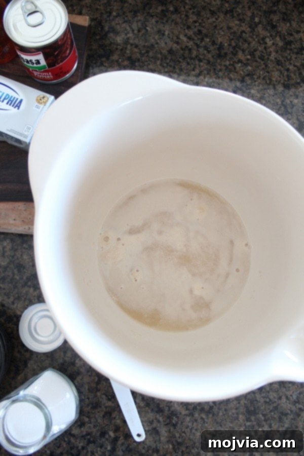 Smoky Sweet Chipotle Cream Cheese Pretzel Poppers 2 Active yeast, water, and brown sugar mixture bubbling in a bowl